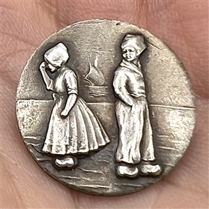 Highly Collectible 3rd Avenue silver button “Dutch Boy and Girl.”