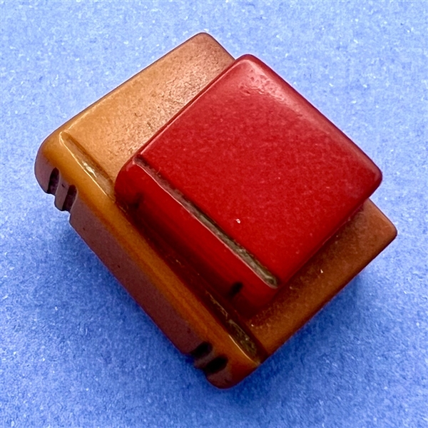 Bakelite realistic stacked books button.