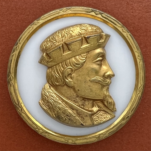 White glass button with an escutcheon of a man’s head.