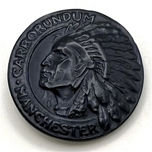 Native American button with verbal border.