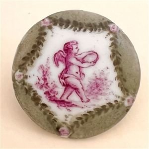 Ceramic button of cherub in purple and green colors.