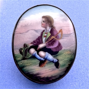 Ceramic oval button of a little boy holding his hat.