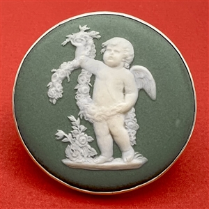 Extra large Wedgwood button of a cherub with a wreath.