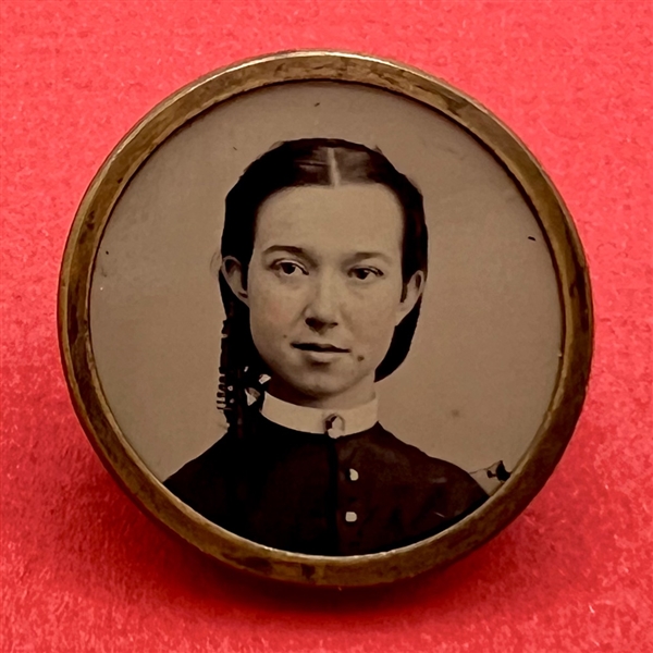 Tintype button of a young woman.