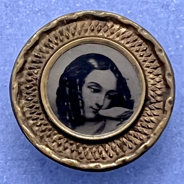 Tintype button of a girl kissing a bird.