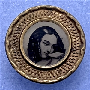 Tintype button of a girl kissing a bird.