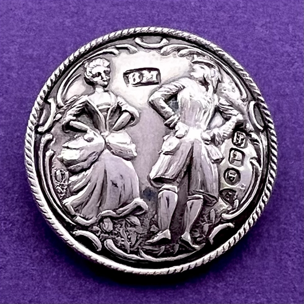 Hallmarked silver button of a couple dancing.