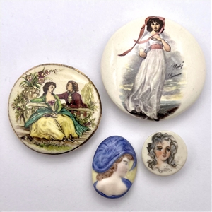 Four ceramic studio buttons by various artists.