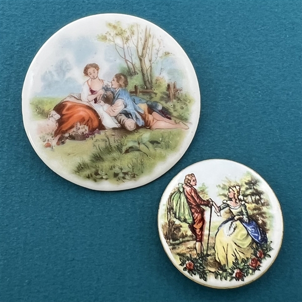 Two porcelain buttons of courting couples.