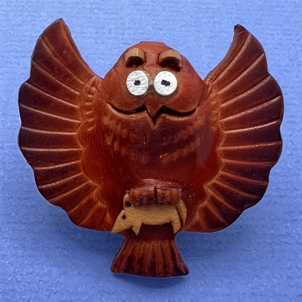 Owl with mouse in talons leather button.