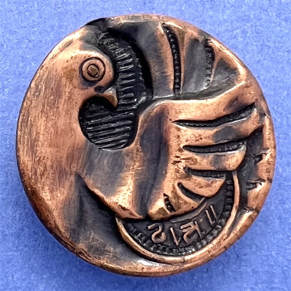 Stamped copper button of “time flies.”