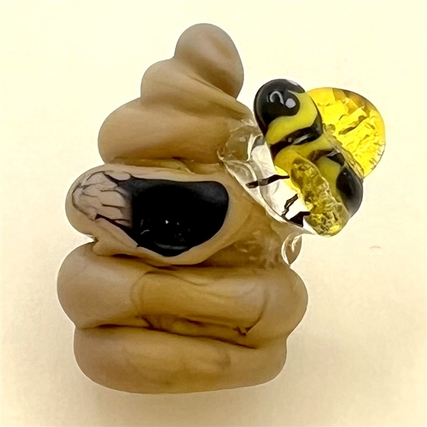 Mary Gaumond’s bee and hive studio glass button.