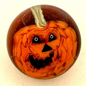 Mary Gaumond’s jack-o-lantern studio glass button.