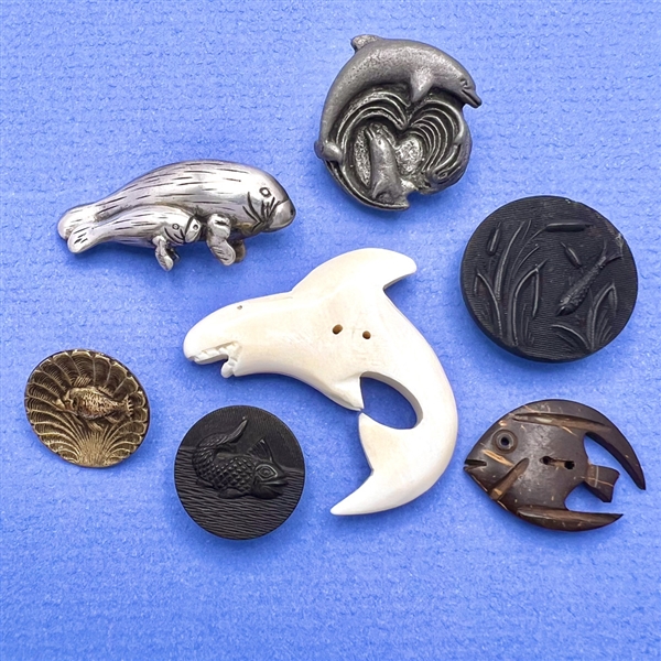 Seven assorted sea creature buttons.