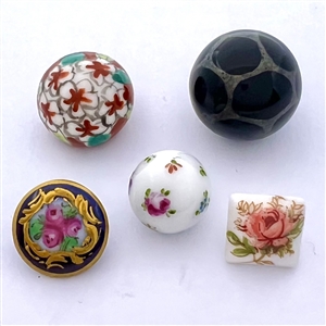 Five ceramic cuties buttons.