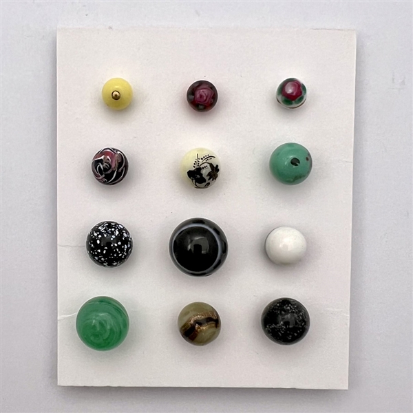 Twelve glass ball buttons.