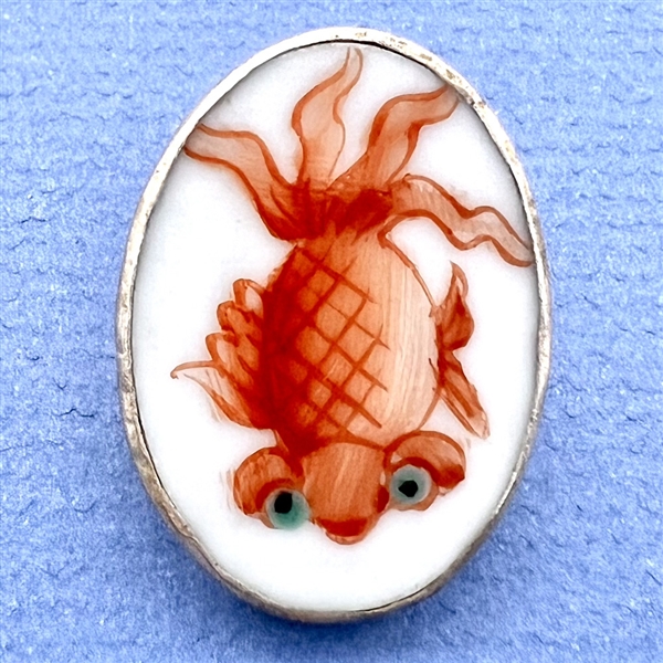 Shard ceramic button of a goldfish.