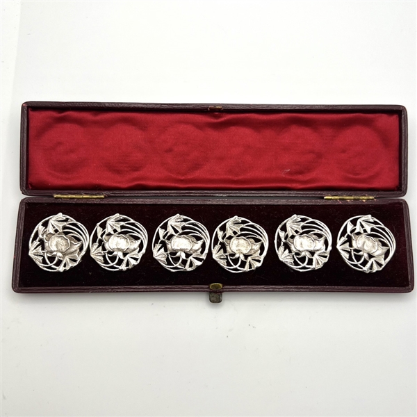 Set of 6 silver buttons of a flower in original box.