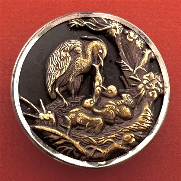 SCARCE Extra large “Heron feeding her young” brass button.