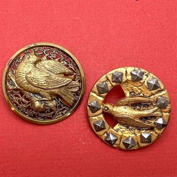 Two brass birds with openwork.