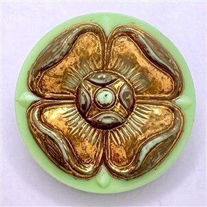 Iridescent brown pearl button with stylized brass fleur-de-lis design.