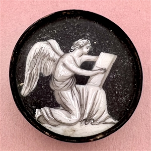 An 18th c. “en grisaille” painting  on natural material button of an angel writing a list.