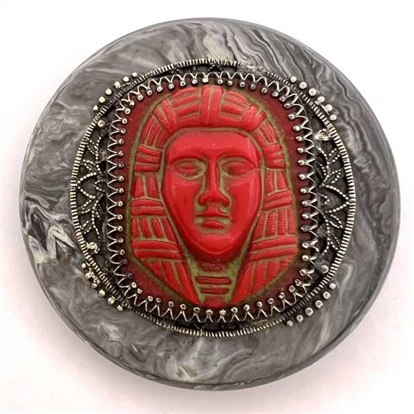 Extra large glass set in brass over synthetic polymer coat button Egyptian subject.