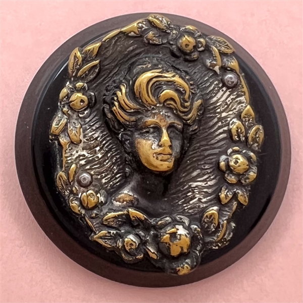 “Gibson Girl”  brass over synthetic polymer coat button.