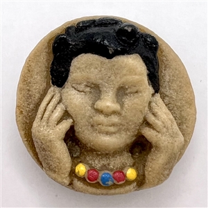 Vintage acrylic shot button of “Hear no evil.”