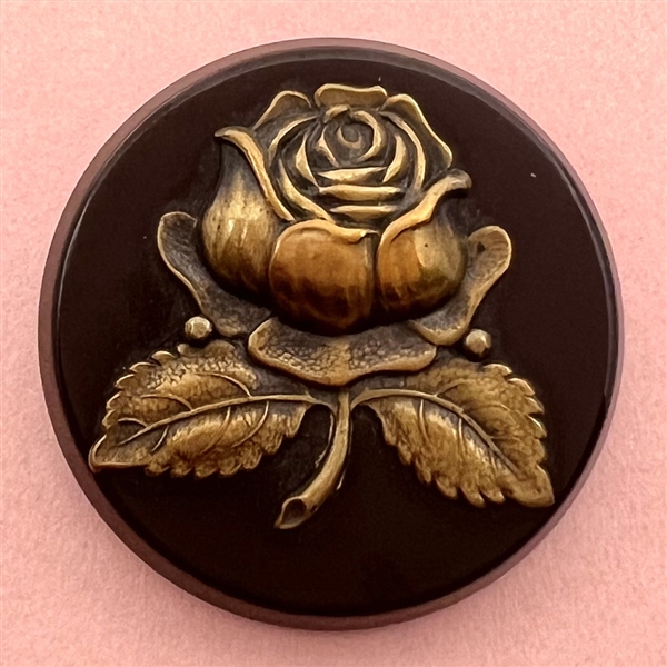 Brass rose over synthetic polymer coat button.