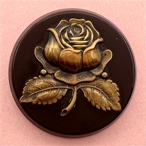 Brass rose over synthetic polymer coat button.