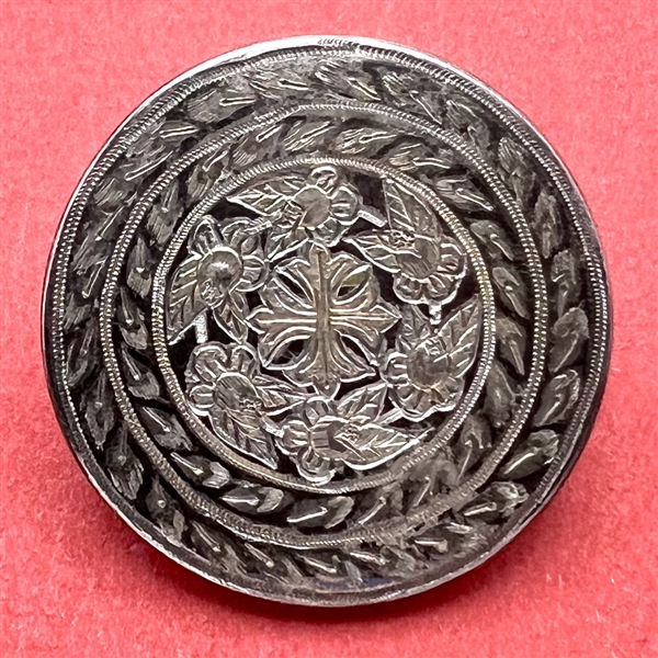 A 19th c. Steel button with cross and flowers.