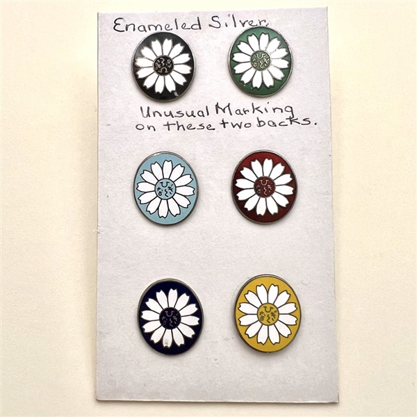 Set of six enameled silver buttons of flowers.