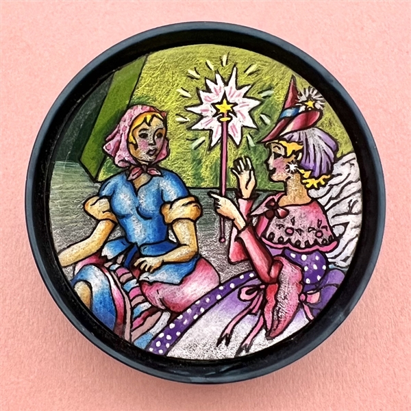 Extra large Atlee button of “Cinderella and Fairy Godmother”.