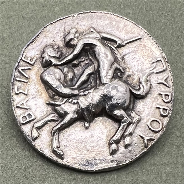 White metal metal button of man fighting a centaur by LIDZ.