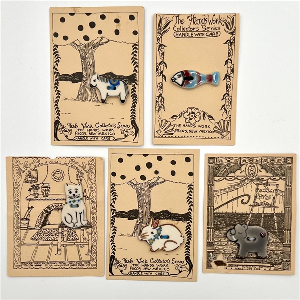 Five cards of “Hands Work” ceramic buttons of animals.