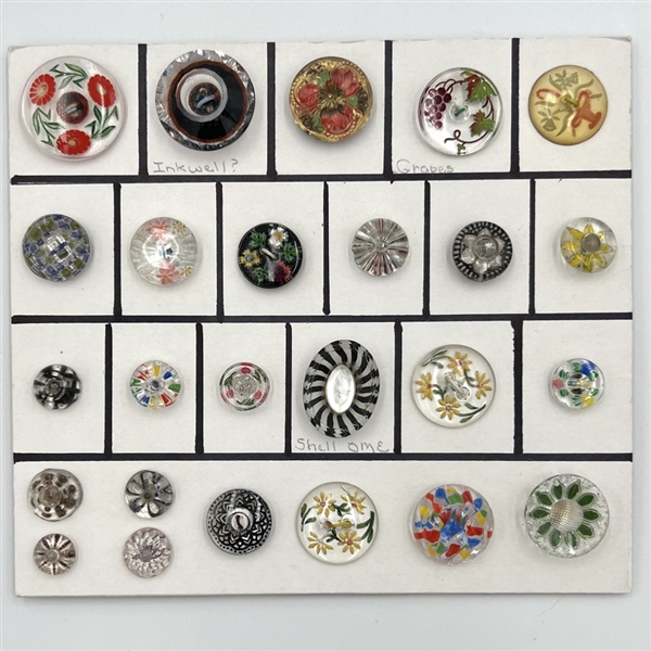 Twenty five assorted reverse carved and painted glass buttons.