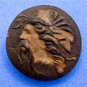 Carved wood cameo button of a bearded man.