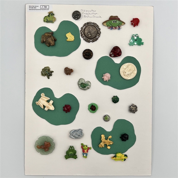 Card of twenty eight frog buttons.