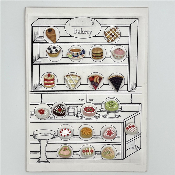 Card of twenty one ceramic buttons of bakery items.