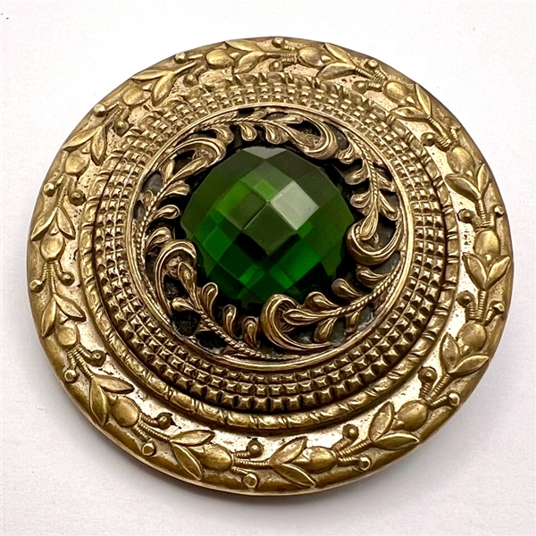 HUGE Gay 90’s button with green jewel.