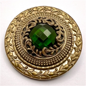 HUGE Gay 90’s button with green jewel.