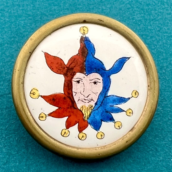 Enamel button of a jester. 