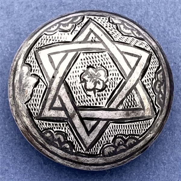 Niello silver button of interlocked star.