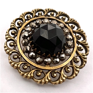 High dome faceted black glass in metal button.