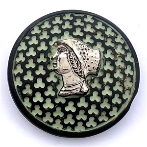 Black glass button with woman’s head.