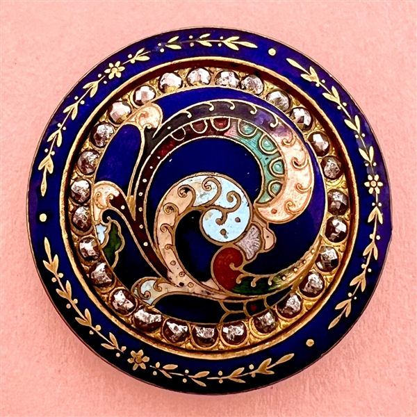 A 19th c. champlevé enamel button with cut steels.