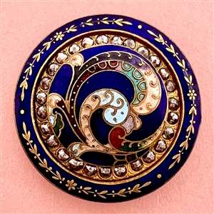 A 19th c. champlevé enamel button with cut steels.