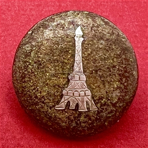 Flecked horn button with silver Eiffel Tower.