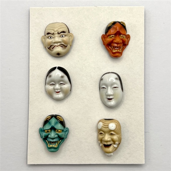 Group of six Arita Asian masks.